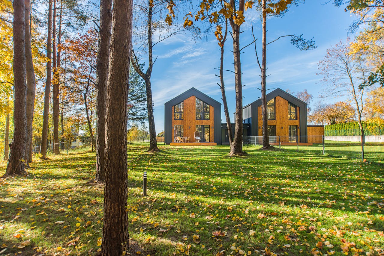 Modern architecture amidst vibrant fall landscape with colorful foliage.
